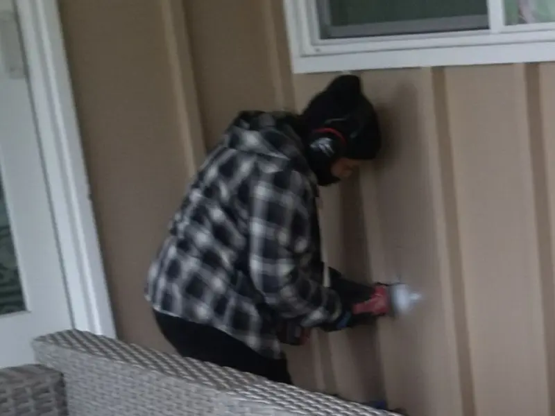 Professional electrician installing an exterior outlet in Fall River