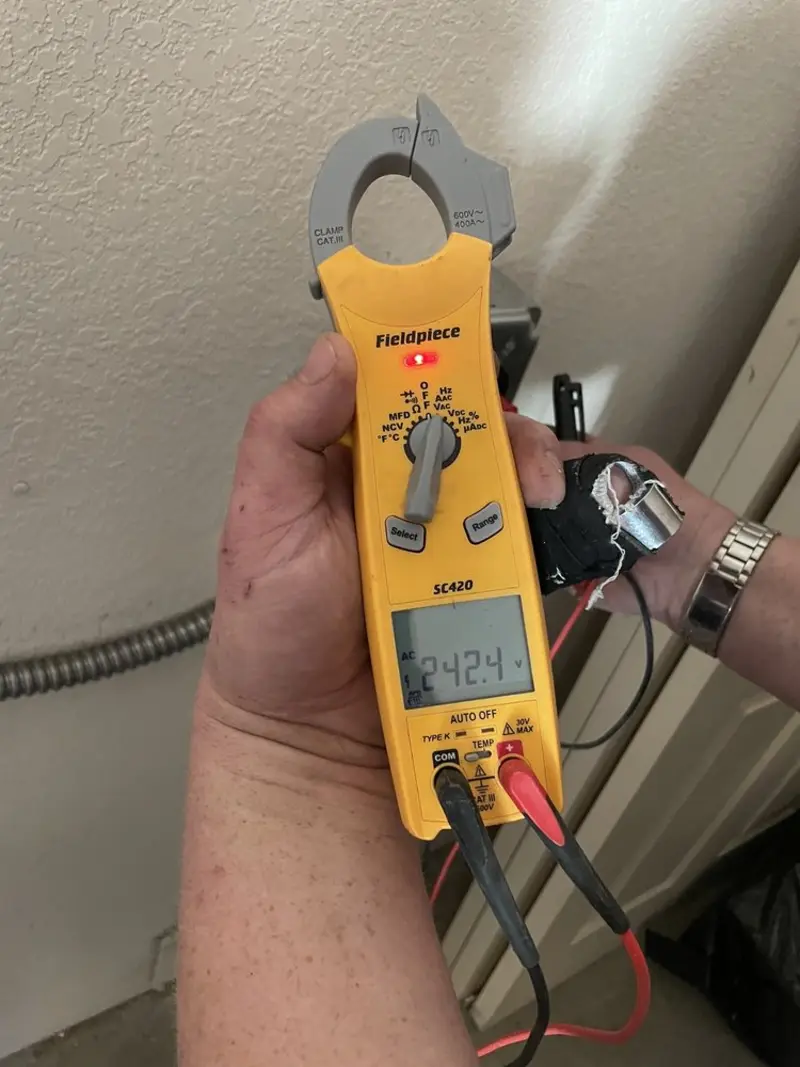 Voltage testing with clamp meter during Recessed Lighting Installation in Fall River